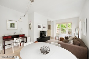 Experience the ultimate in pin drop quiet, Zen like living in this sun drenched, custom designed corner unit featuring high ceilings and seven expansive windows.