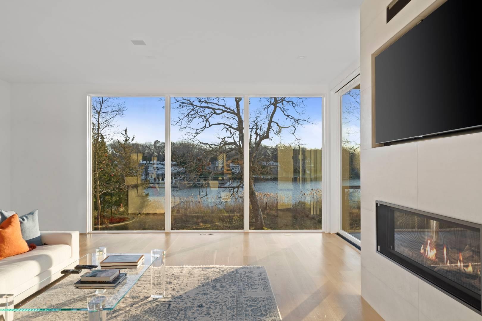 Living room featuring expansive windows and light wood-type flooring