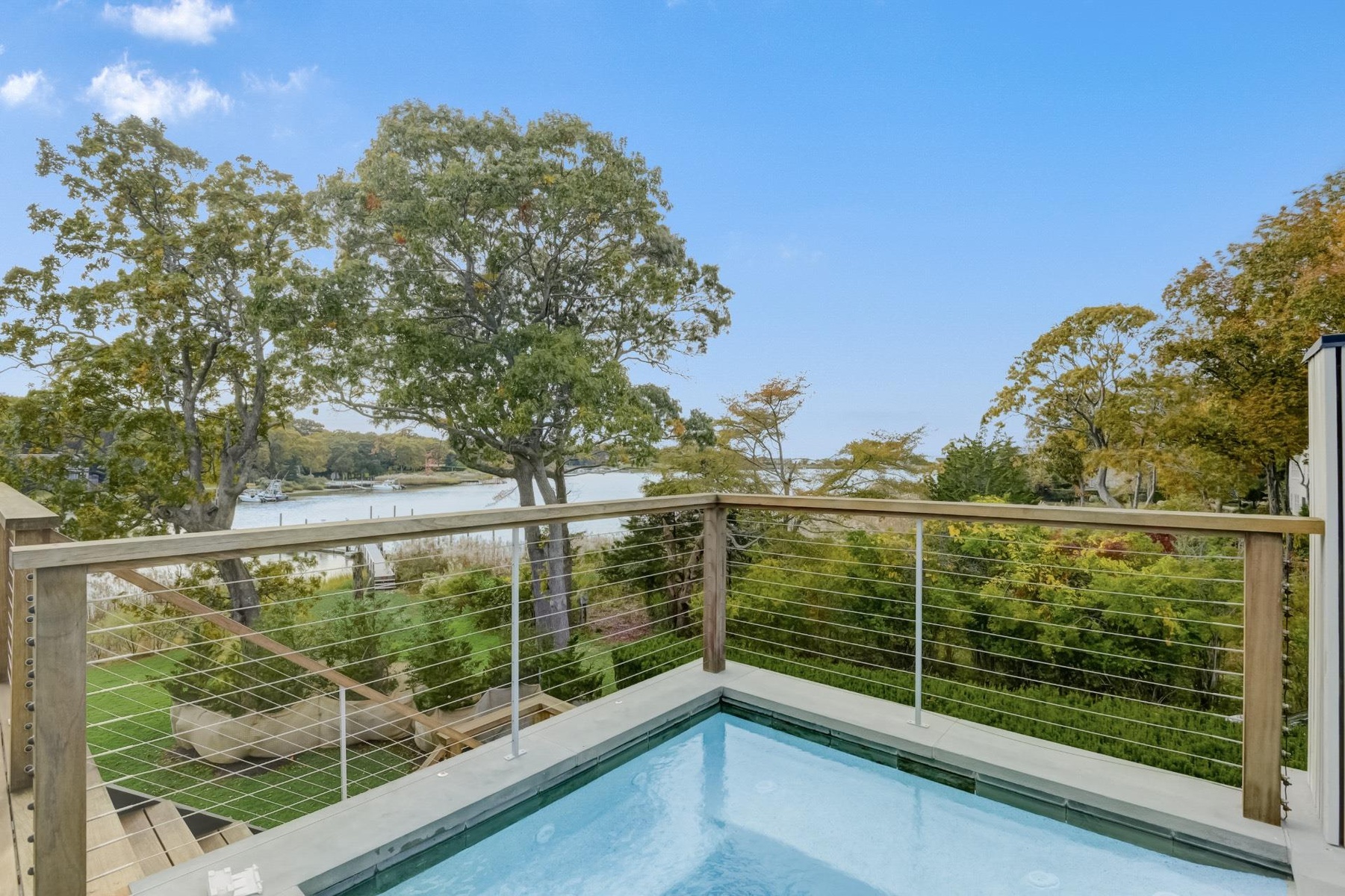 View of pool with a water view