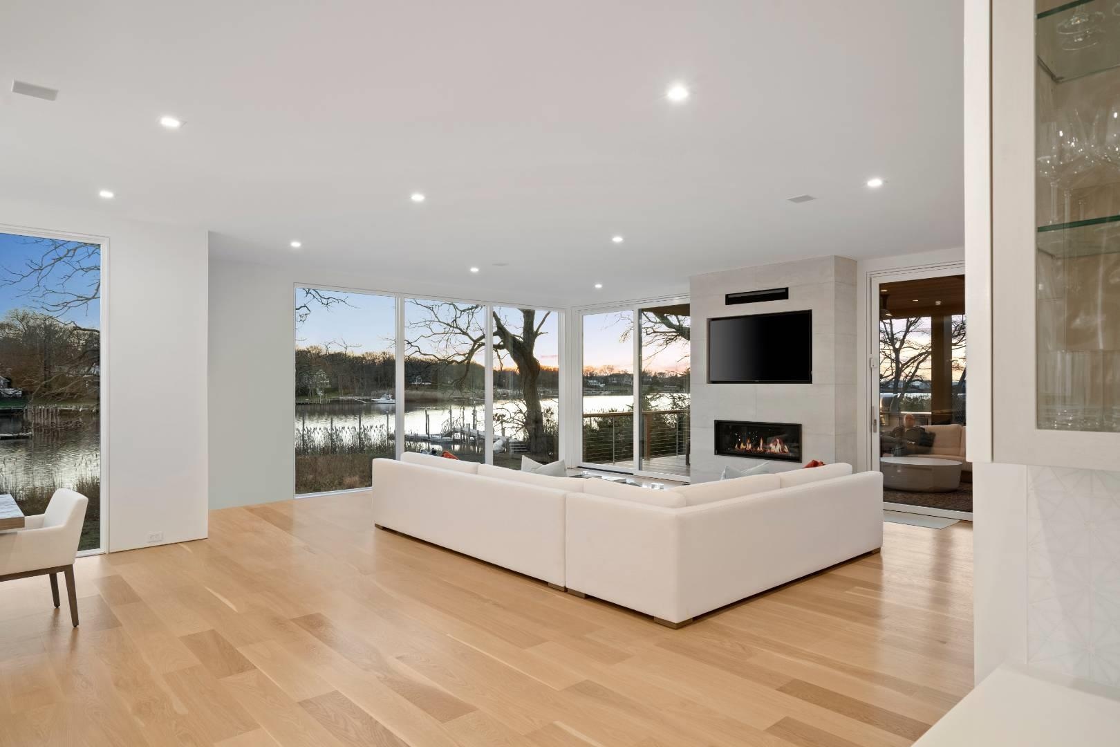 Living room with a fireplace and light hardwood / wood-style floors