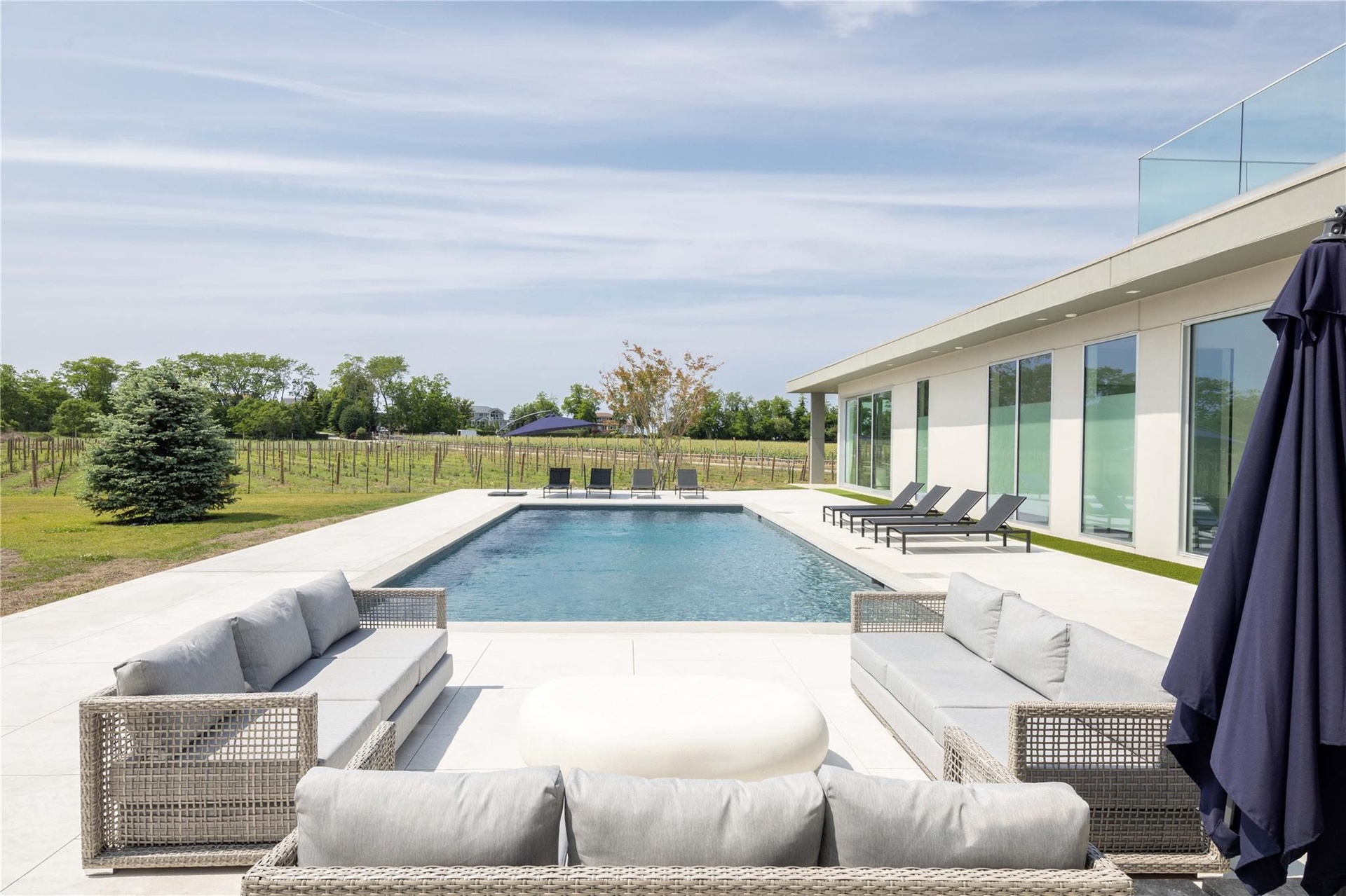 View of swimming pool featuring a patio and an outdoor hangout area