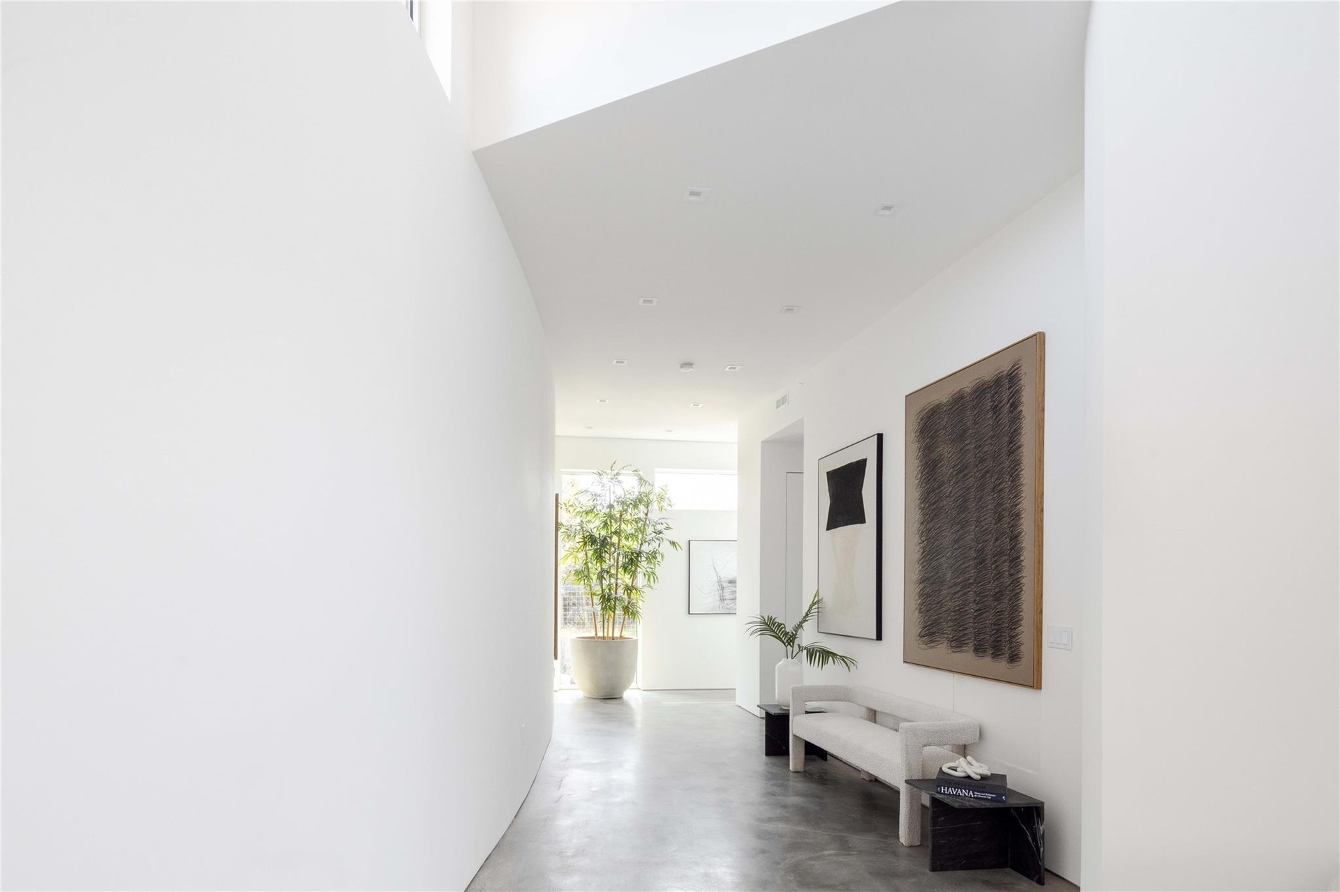 Hallway featuring concrete flooring
