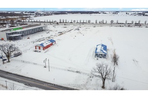 Strategically positioned with highway frontage and exceptional accessibility, this fully secured and fenced 7.