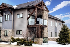 Stunning End Unit One Bedroom Den Condo at Mountain House.