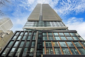 Discover this spacious 1 Den unit in the brand new The Saint Condos, offering 698 sq.