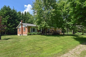 Everything you have been looking for in a rural property, including privacy, easy access to town amenities, well maintained bungalow amp ; large 25 ft.