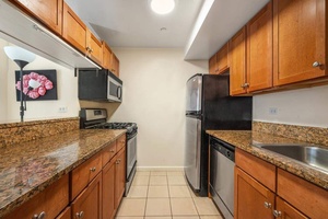 Two bedroom, two bathroom apartment with beautiful wood floors and south facing balcony overlooking a garden and High Line Park.