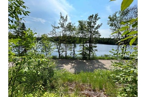 Excellent opportunity to develop your cottage getaway or year round property on this elevated 1 2 acre treed lot with a level area up top and spectacular views of Brady ...