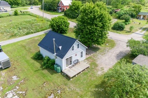 Discover the charm of this adorable cabin inspired home, ideal for those seeking a peaceful retreat or a lucrative investment opportunity.