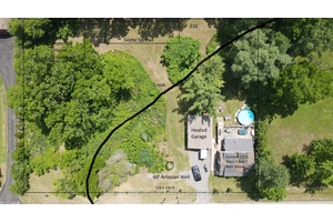 This near one acre property features a beautiful 3 bedroom home and a new heated 2 car garage.