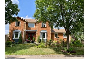 Nestled on a prime corner lot, this home boasts a special blend of privacy and unparalleled curb appeal with no sidewalk in front of the house to spoil the view.