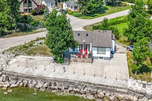 Spectacular water front property boasting 148ft of beach front protected by prof.