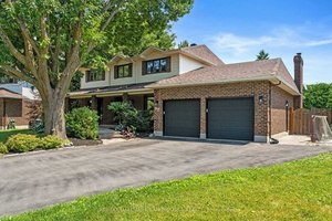 Welcome to 97 Thare Crescent, a meticulously updated executive home nestled on a quiet, family friendly crescent in sought after Barrhaven.