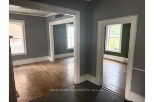 EAST SIDE UNIT VACANT ! Located in the heart of Morrisburg this stately two storey semi detached brick home offers charm, character, and endless potential.