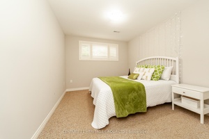 Welcome to 5826 Fiddlehead Lane Beautifully Designed one of a kind very spacious raised bungalow.