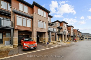 Welcome to 61 Soho Street, Unit 123, a beautifully crafted END UNIT freehold townhouse nestled in the highly desirable Central Park community !