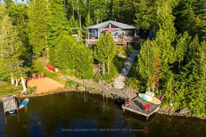 Welcome to this turn key, four season waterfront cottage on sought after Steenburg Lake, offering stunning western exposure, a sandy beach, and your own private boat launch.