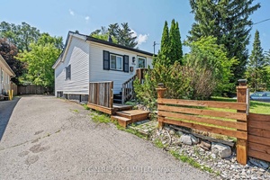 Welcome to this delightful 2 Bedroom Bungalow ideally situated on a huge 1 4 acre 273 ft.