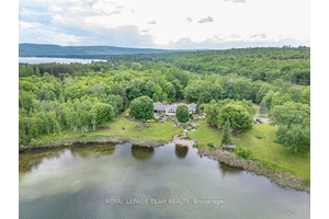 Luxury Executive Estate on Little Lake Clear Featuring a Heated Indoor Pool, Hot Tub amp ; 5 Private Acres on sought after Little Lake Clear.