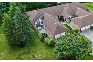 Welcome to this rare end unit bungalow townhome, offering 1, 577 sq.