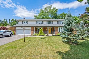 Spacious and versatile, this large two storey home offers 5 1 bedrooms on a beautifully treed city lot in a prime central location, close to schools, parks, public transit, and ...