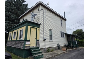 THIS DUPLEX ON TRIANGLE CORNER LOT ON HELEN STREET IN SMITHS FALLS IS READY FOR YOUR PERSONAL TOUCH AND HAS SO MUCH POTENTIAL FOR INVESTMENT OR, FOR THE RIGHT BUYER, ...