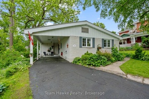 This all brick bungalow blends charm, comfort, and a great central location.