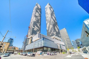 Luxurious Sugar Wharf condos by Menkes in prime downtown waterfront location.