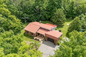 Top 5 Reasons You Will Love This Home 1 Nestled on an elevated and private 1 acre lot, this delightful ranch style bungalow delivers both tranquility and convenience, located just ...