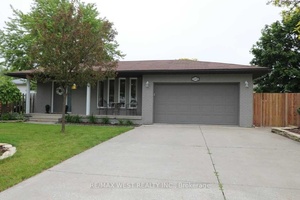 Welcome to 13050 St. Thomas a beautifully renovated 4 level backsplit nestled on a generous corner lot in the heart of Tecumseh.