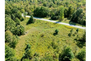 Country property with 5 acres of land and 825 feet of road frontage along the north side of Crozier Road.