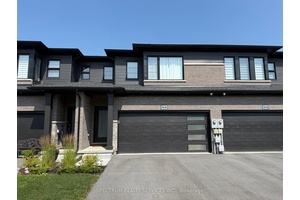 Impeccable Freehold 3 Br Townhome 1696 Sqft Above Ground With Attached Two Car Garage Locates In A Desirable Neighborhood Of New Forest View Subdivision.