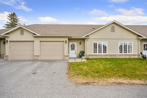 Enjoy low maintenance living in this thoughtfully designed one level townhouse.