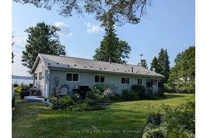 IMMACULATE 3 BEDROOM 1 BATH WATERFRONT HOME COTTAGE IDEALLY LOCATED ON AN IMPRESSIVE LEVEL MANICURED GROUNDS amp ; CIRCULAR DRIVEWAY WITH SINGLE DETACHED GARAGE WORKSHOP amp ; LEAN TO STORAGE.
