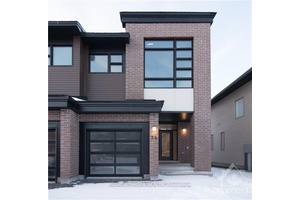 This beautifully maintained Urbandale Discovery model townhome features hardwood flooring throughout the open concept living and dining areas, with upgraded tile in the entryway and kitchen.