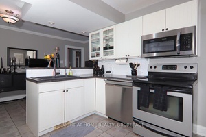 Welcome to this lovely classic 1 1 2 story home built in 1939, surrounded by other character homes on this nicely treed stretch of Queenston St.