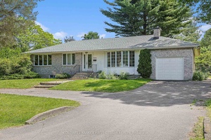 Welcome to this charming bungalow on a huge lot in Revelstoke Mooney's Bay.