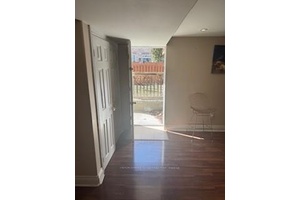 Welcome to this walkout two bedroom basement apartment, featuring a spacious open concept layout that seamlessly integrates the kitchen, living room, and dining area.