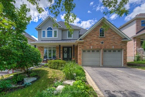 Stylish Home boasting both elegance and comfort in a most desirable location backing onto treed lands.