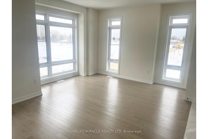 Welcome to this exceptional 4 bedroom, 4 bathroom townhome on a premium corner lot, perfectly positioned pond facing with clear greenery views.