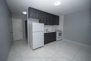 Renovated Upper Floor Apartment Situated On Eglinton Avenue East, Boasting A Prime Location.