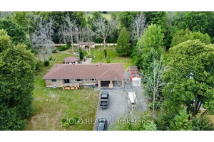 Welcome to 20411 Concession Road 5 in peaceful Green Valley a move in ready all brick bungalow offering 3 bedrooms, 2 baths, and approx.