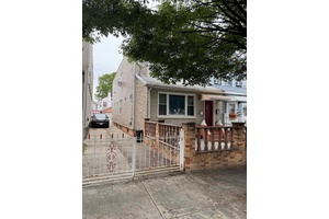 Two Family Home In Great Location, Home Has A Lot Of Potential, Close to JFK airport Close To Transportation And Shopping.