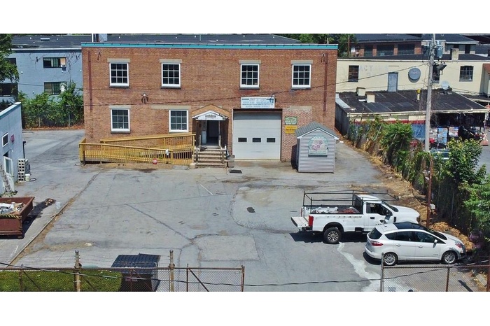 View of property featuring a garage