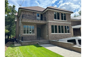 this beautiful new construction nestled in the heart of the highly sought after waterfront community of Malba, this elegant residence offers timeless charm, privacy, and modern luxury.