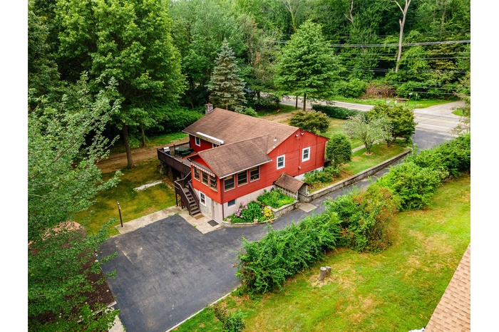 View from above of property with a heavily wooded area