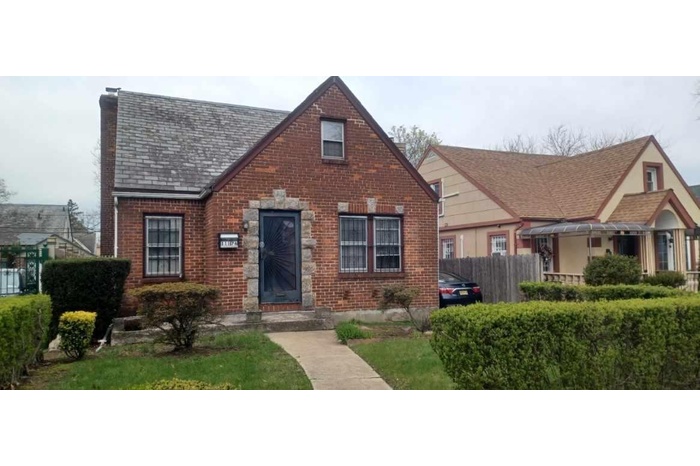 Tudor-style house with brick siding