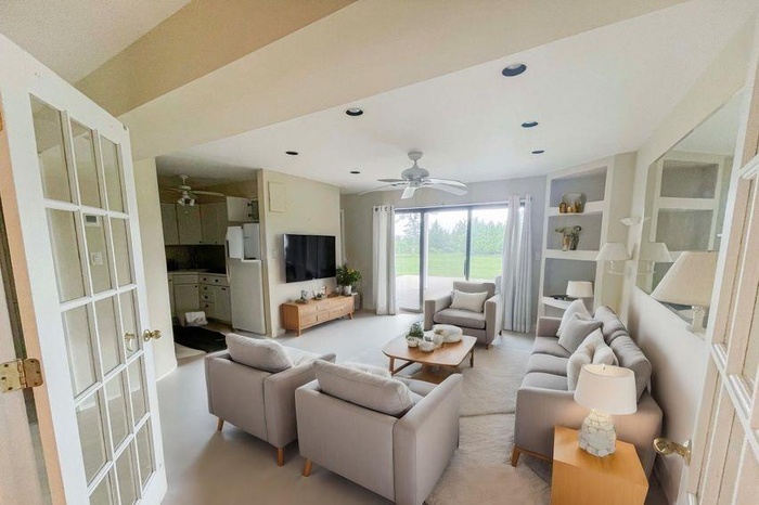 Living area with french doors, a ceiling fan, and recessed lighting