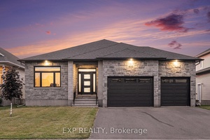 Welcome to this 3 2 bedroom, 3 bath bungalow on a PREMIUM LOT with a water view, located in the sought after community of Russell Trails.