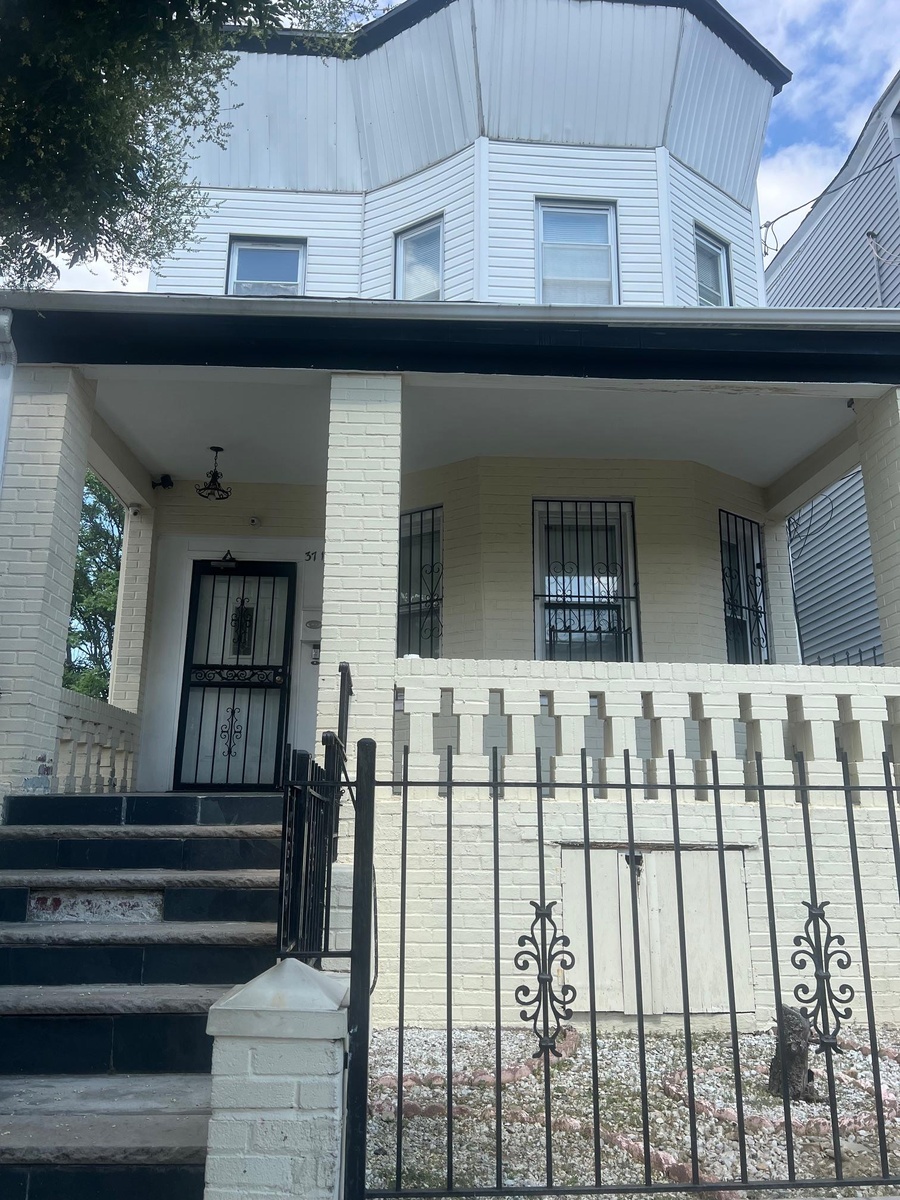 Property entrance featuring covered porch